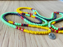 Load image into Gallery viewer, colorful waistbeads swirled with YD charm showing
