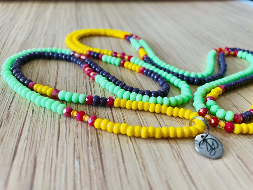 colorful waistbeads swirled with YD charm showing